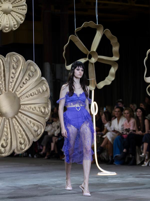 A woman in purple walks down the Runway at Australian Fashion Week. (Image: Australian Fashion Week)