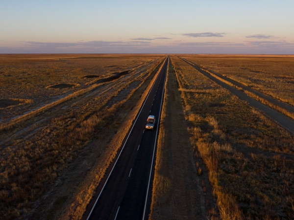 an aerial view of a car passing by Savannah Way