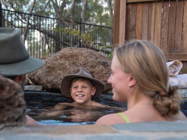 a family dipping in Talaroo Hot Springs