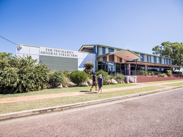 two people walking toward Ted Elliott Mineral Collection at TerrEstrial Visitor Information Centre