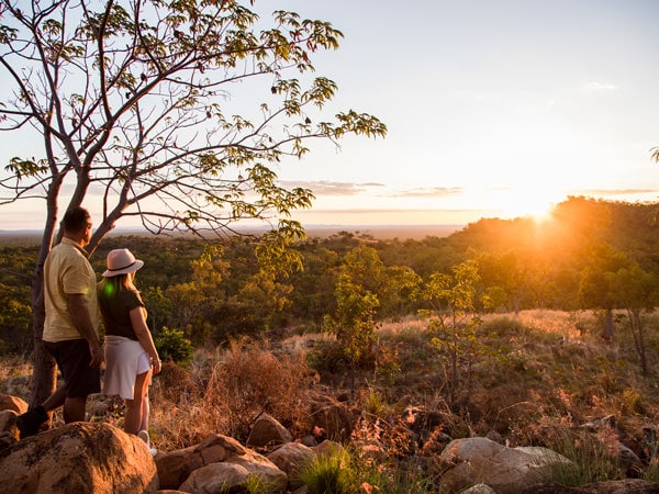 two people looking at the sunset during the sunset wildlife tour with Undara Experience