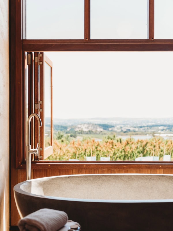 a bathtub by the window at Basalt, Orange