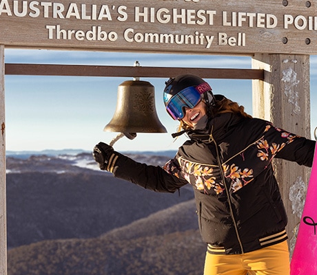 Skier ringing the bell at a sunrise session, Thredbo
