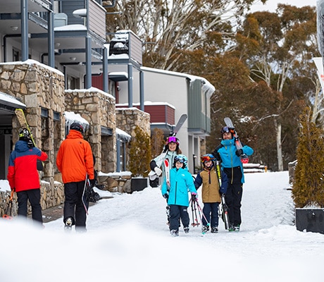Family walking through Thredbo Village