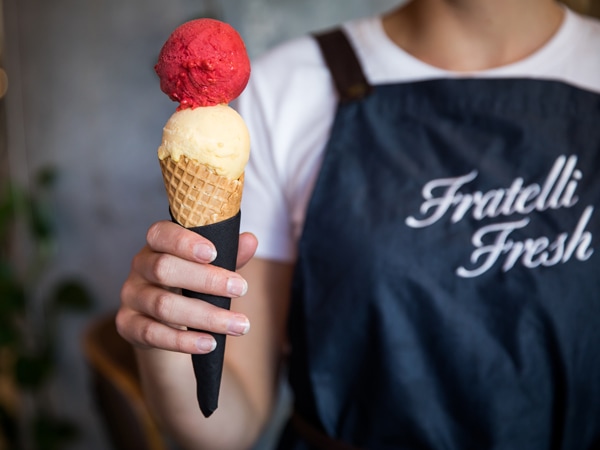 a person holding a cone of gelato at Fratelli Fresh