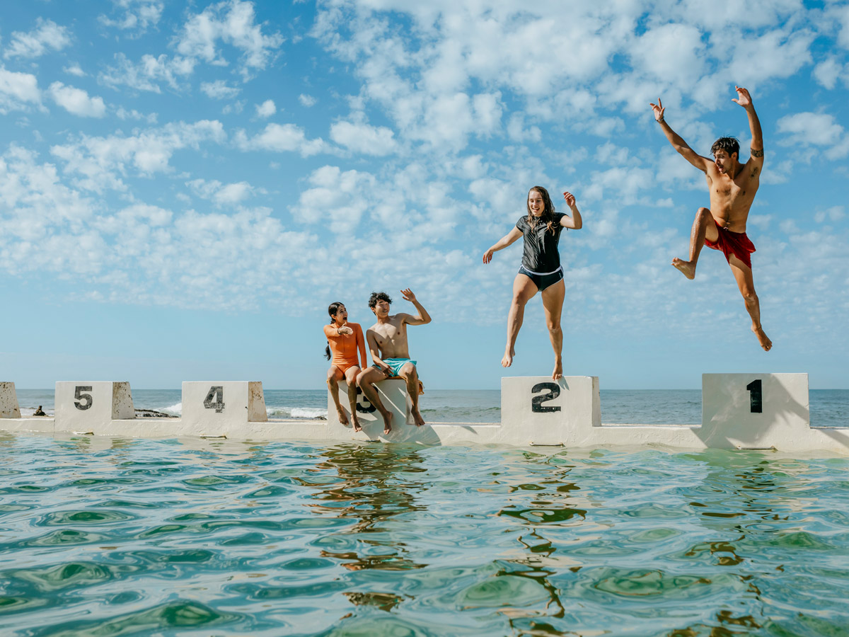 teens jumping into the water at Merewether Ocean Baths