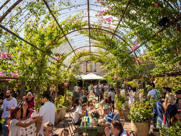 people dining in a garden-inspired restaurant at The Grounds of Alexandria