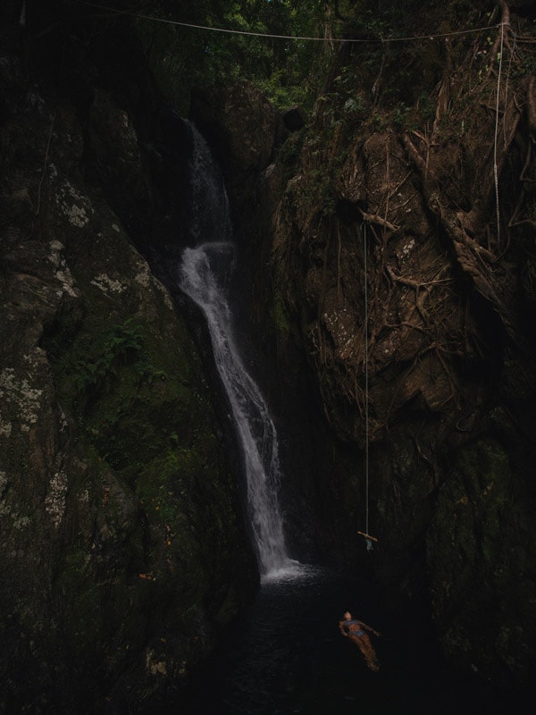 a woman floating on Fairy Falls, Cairns