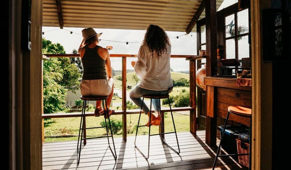 Couple on the deck at Hazy Stays in Byron Bay