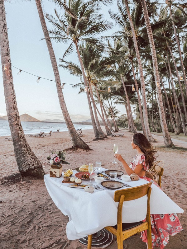 a woman drinking by the beach at Nu Nu Restaurant, Palm Cove