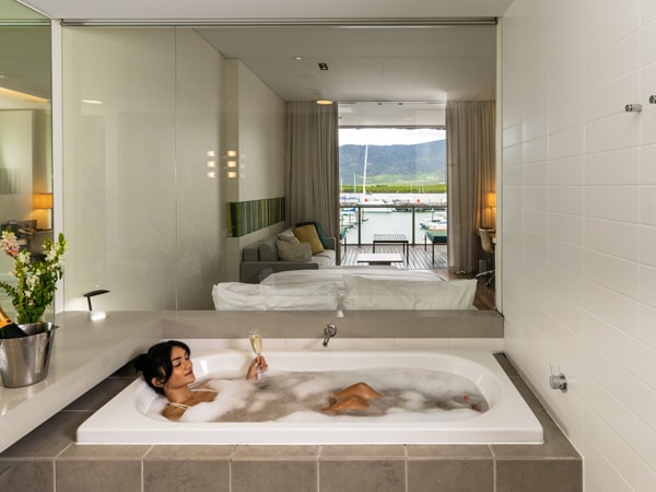 a woman dipping in the bathtub at Shangri-La The Marina