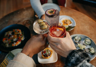 clinking cocktail glasses at Grainery Lane, Ballarat