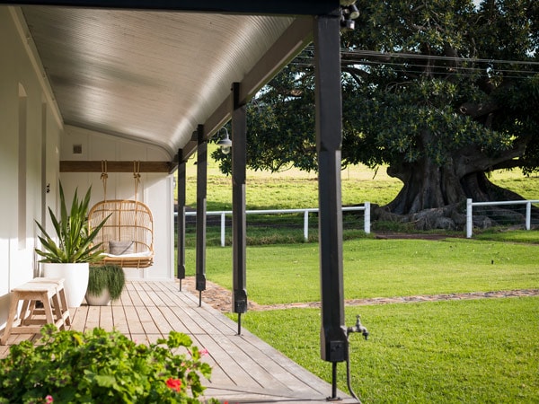 an outdoor deck with a hammock in Dunoon Farmhouse, Kiama
