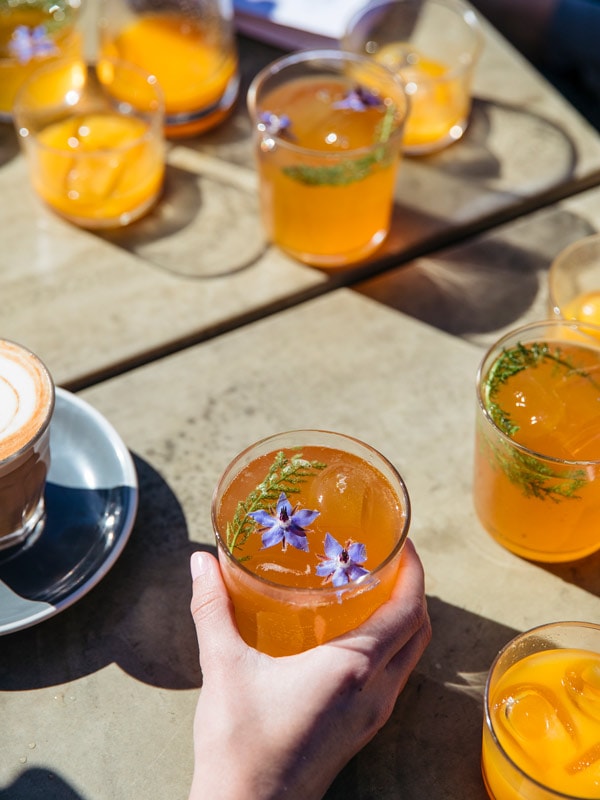 People holding a cool drink at Estabar, Newcastle