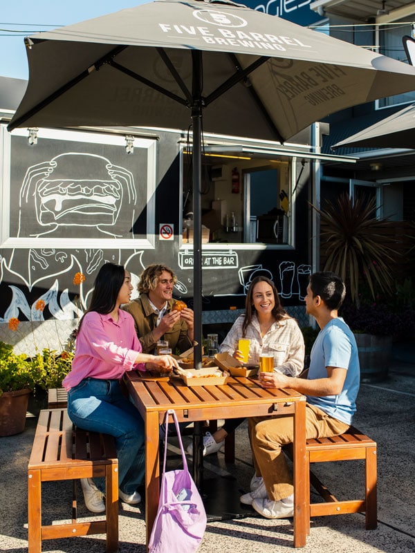 friends dining al fresco at Five Barrel Brewing, Wollongong