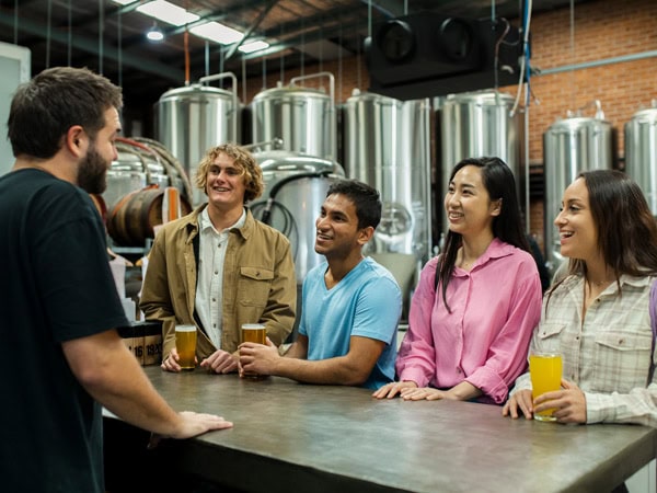 friends touring the Five Barrel Brewing brewery in Wollongong