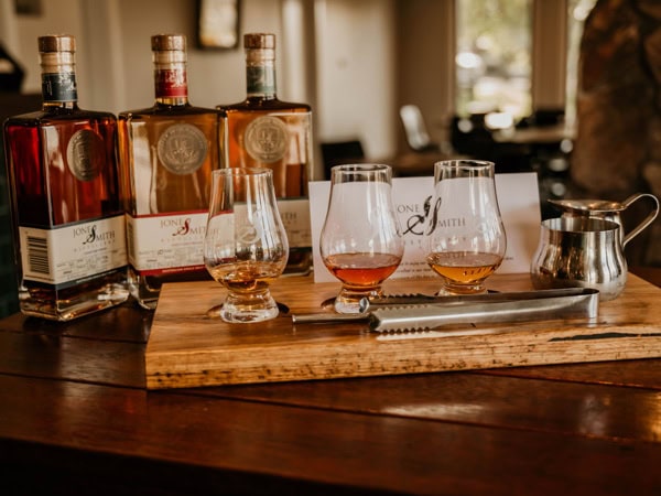 spirit bottles and glasses on the table at Jones & Smith Distillery, Orange
