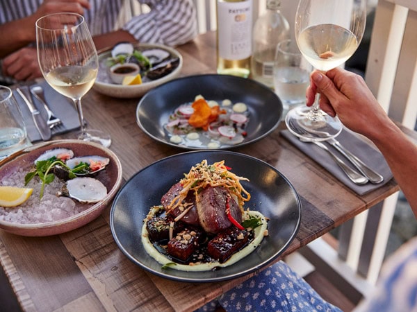 food plates with drinks on the table at Latitude 30, Coffs Harbour