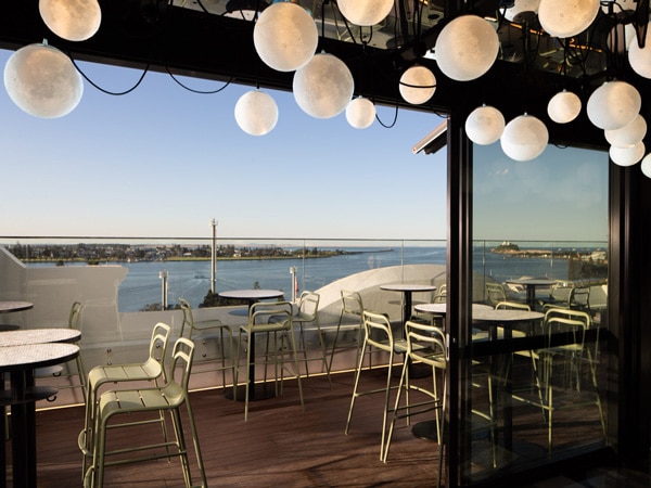 the venue ceiling with pendant lights at Rooftop At QT