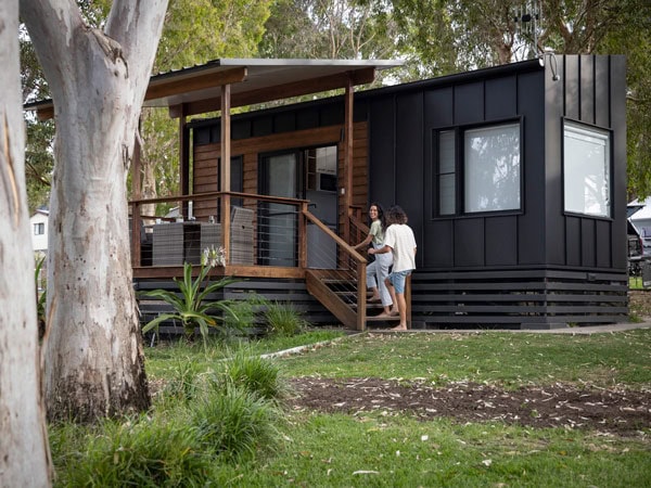 a couple entering their cabin at Reflections Coffs Harbour Moonee Beach