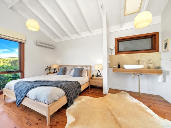 a cosy bedroom at Saddleback Grove, Kiama