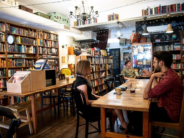 people having coffee inside The Press Coffee and Book House, Newcastle