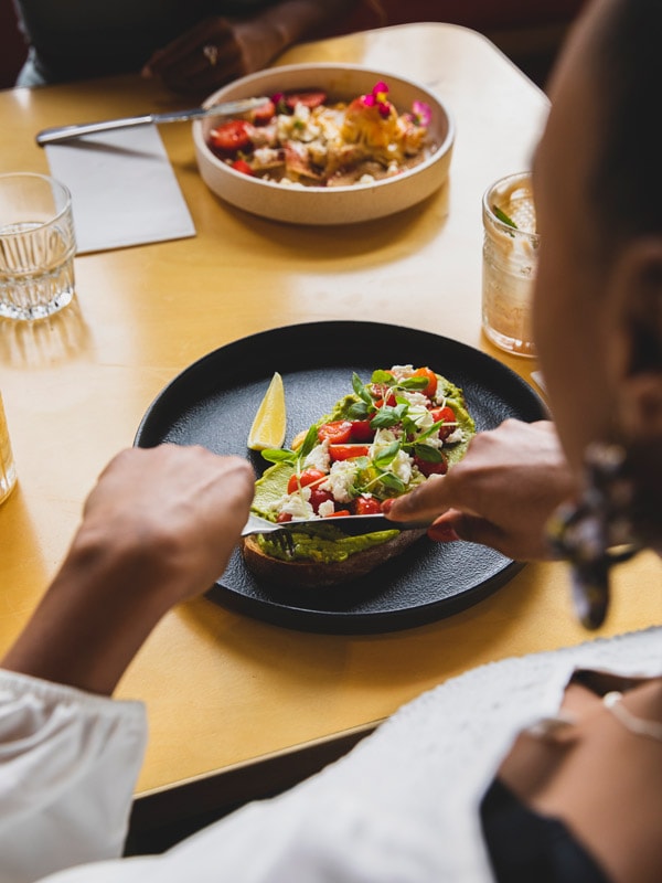 a woman enjoying her food at The Signal Box, Newcastle