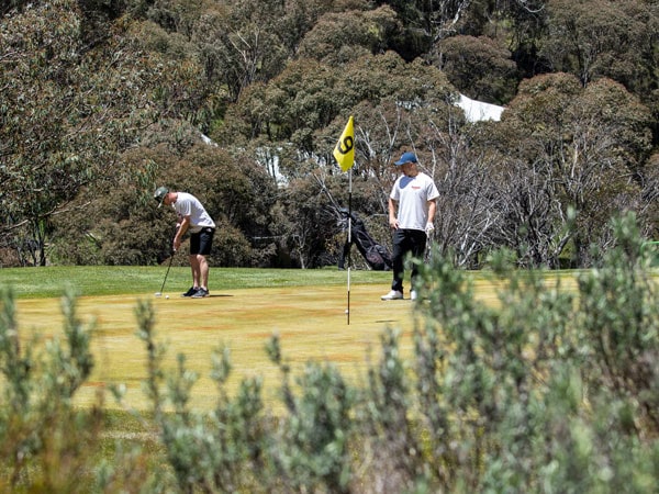 two people playing golf at Thredbo Golf Club