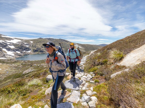 a group of hikers passing by Alpine Lakes