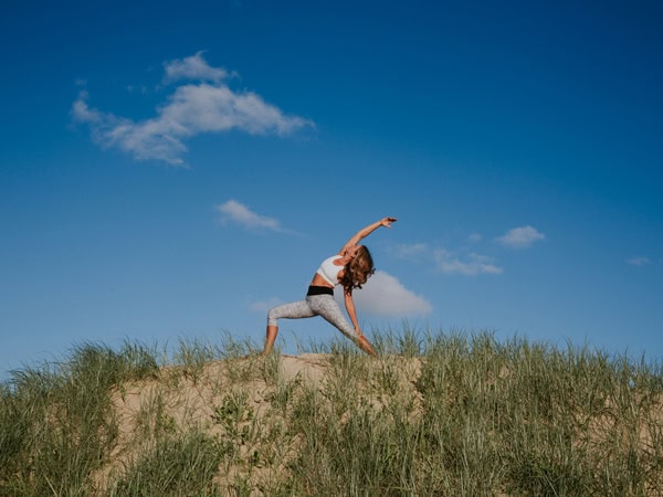 a woman doing some yoga on Lord Howe Island