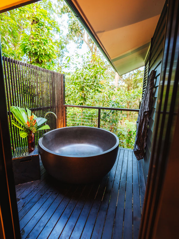 an open-air bathtub at Silky Oaks Lodge, Port Douglas accommodation