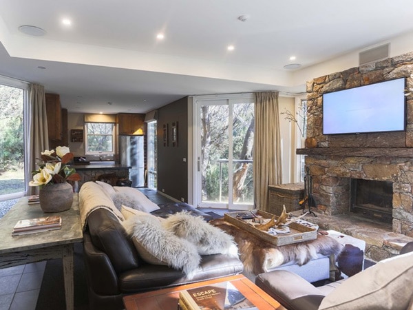 a lounge and kitchen at Rockpool Lodge, Thredbo