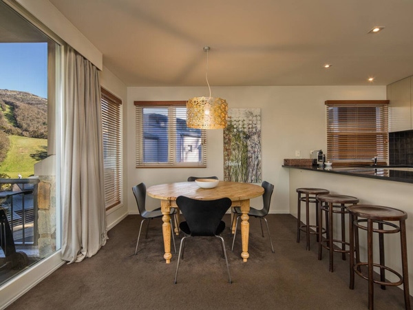 the kitchen and dining interior at Snowman Apartment 4 Thredbo
