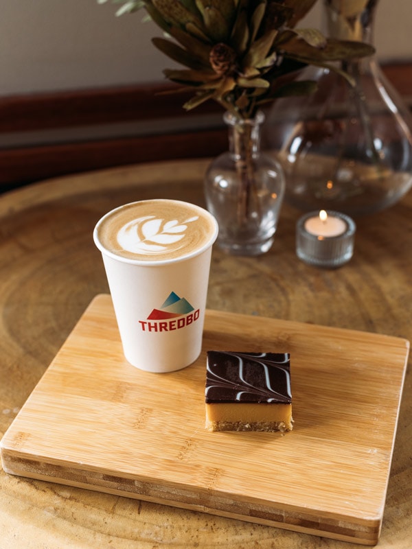 a cup of coffee with a slice of pastry at The Bakery in the Village Square