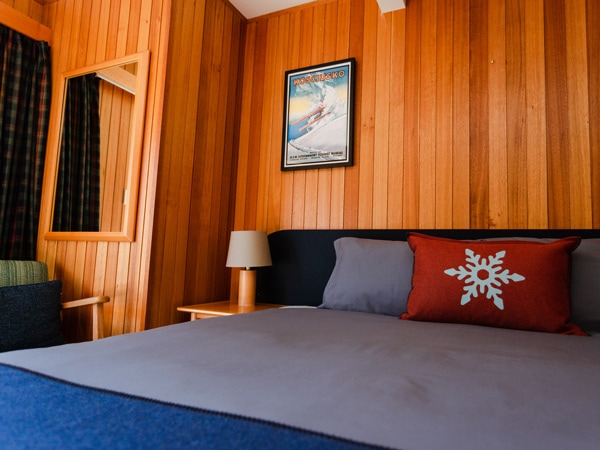 a rustic bedroom at Thredbo Alpine Hotel