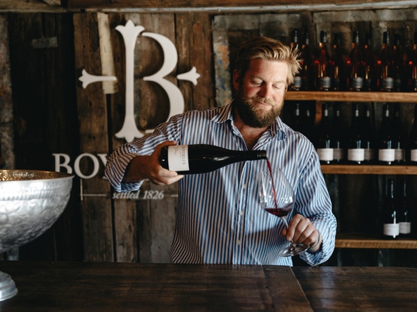 Boydell's winemaker Daniel Maroulis pouring a glass of red wine at his cellar door