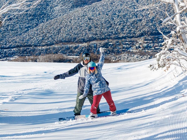 two people enjoying skiing in Thredbo