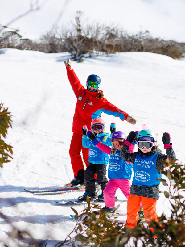 a father with his kids skiing in Thredbo