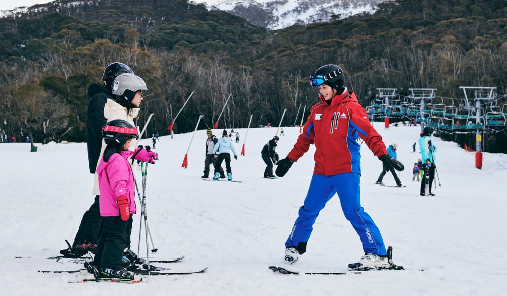 a family learning how to ski with an instructor at Thredbo in the Snowy Mountains