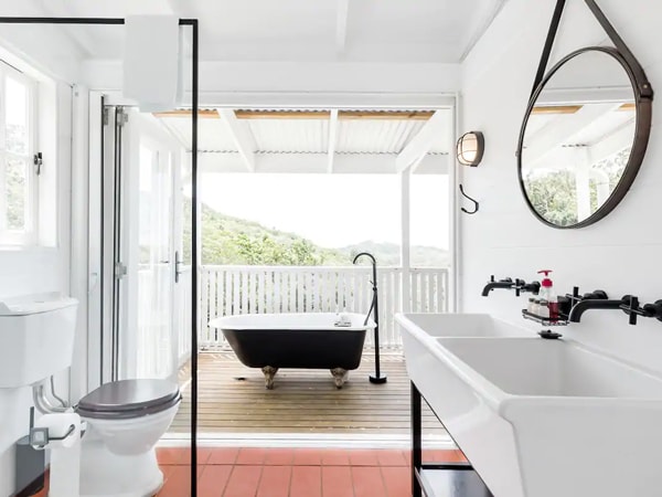 a black and white bathroom interior at Little Red Barn, Doonan