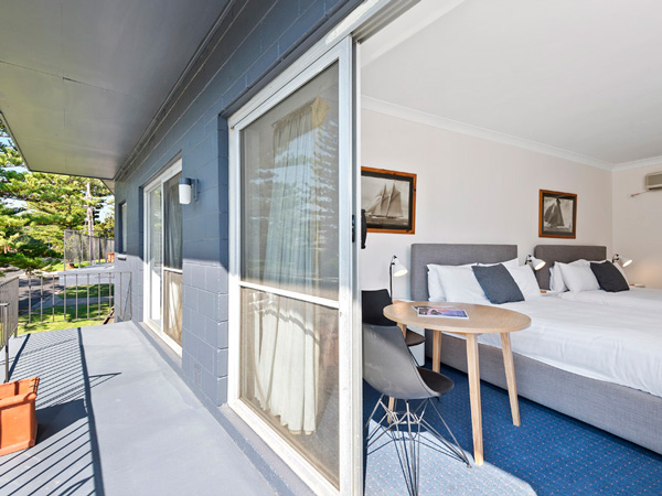 a room with a balcony at The North Pier Hotel, Phillip Island
