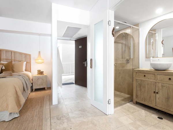 a cosy bedroom interior at Sabi Suite, Noosa Heads