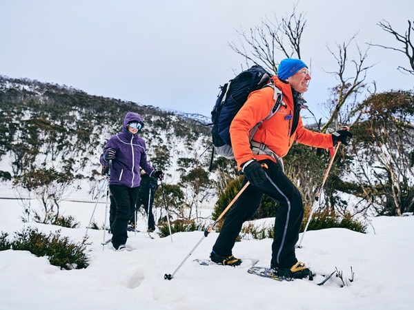 a group passing through Dead Horse Gap, Thredbo on a snowshoe adventure