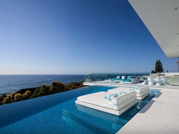 a huge infinity pool with loungers at Spyglass