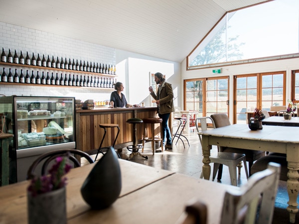 a man ordering at the counter of Usher Tinkler Wines