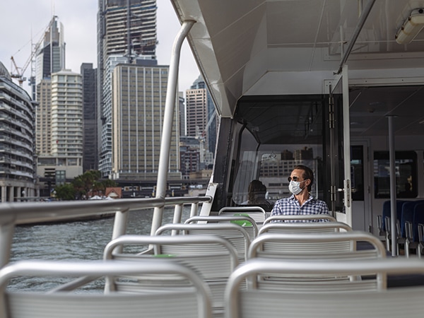 Man Wearing Face Mask While Riding Ferry