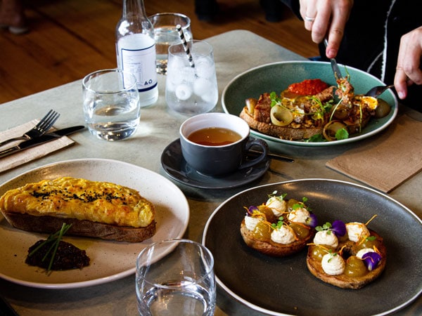 Person eating breakfast at Ballarat’s Clothesline Cafe