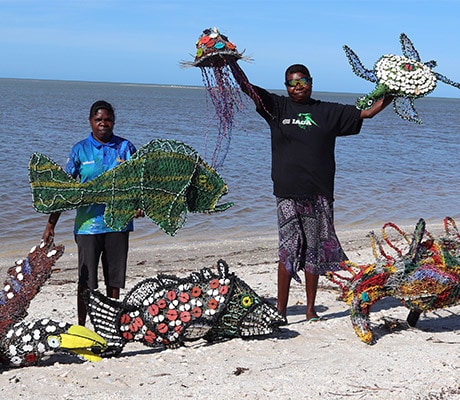 Christine Yantumba and Mylene Holroyd with their ghost net sculptures, Darwin City, Australia