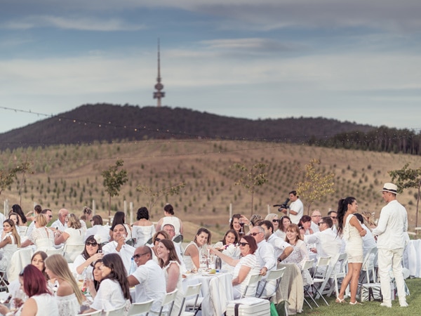 People in white at tables.