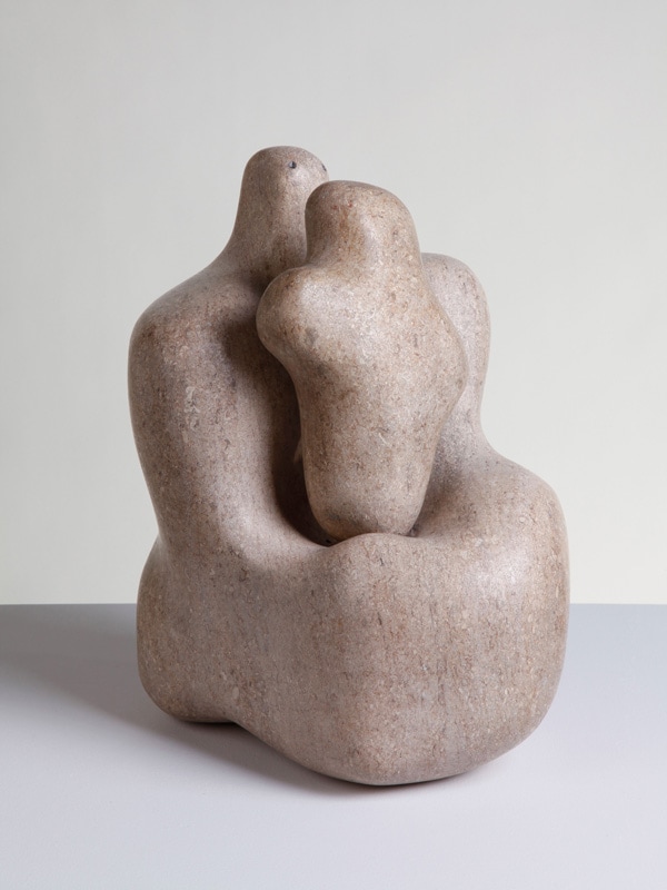 A sculpture of two women